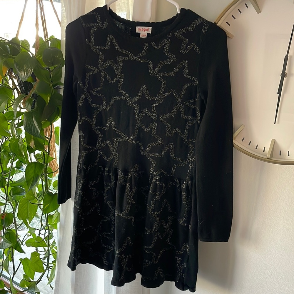 Cute long-sleeve knit black dress with gold star details
